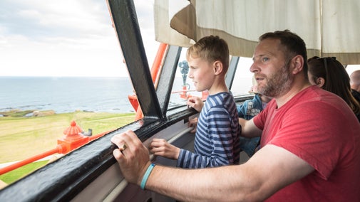 A family exploring the lantern room at Souter Lighthouse and The Leas, Tyne & Wear